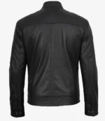 A black leather jacket is shown from the back against a plain white background. The jacket features clean, sleek lines with button details at the cuffs, conveying a classic, stylish look.