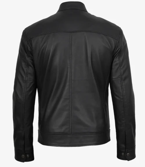 A black leather jacket is shown from the back against a plain white background. The jacket features clean, sleek lines with button details at the cuffs, conveying a classic, stylish look.