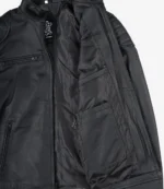 Open black leather jacket showing the inner lining with pockets. The exterior has a smooth texture with visible stitching, conveying a sleek, modern style.