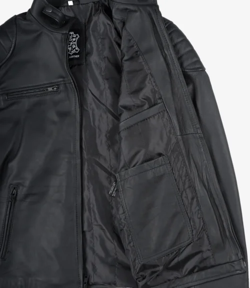 Open black leather jacket showing the inner lining with pockets. The exterior has a smooth texture with visible stitching, conveying a sleek, modern style.