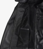 Open black leather jacket revealing a sleek interior with multiple pockets. The soft texture and zipper details suggest a stylish and functional design.