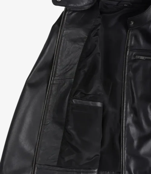Open black leather jacket revealing a sleek interior with multiple pockets. The soft texture and zipper details suggest a stylish and functional design.