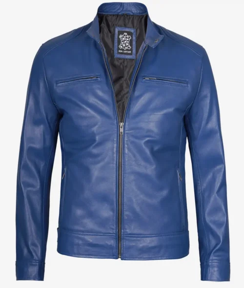 Blue leather jacket with a zip-up front and stand collar. Features two chest pockets and sleek design. Tag inside reads Real Leather.