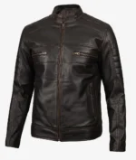 A sleek, dark brown leather jacket with a stand-up collar and front zipper. It features two horizontal zippered chest pockets, exuding a classic, edgy style.