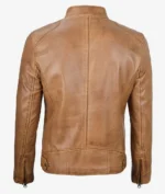 Back view of a tan leather jacket on a plain background. The jacket features a high collar, seam details, and zippers on the sleeves, conveying a classic and stylish look.