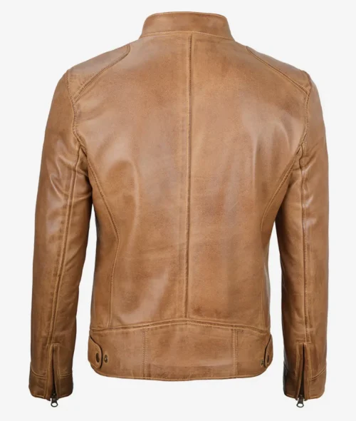 Back view of a tan leather jacket on a plain background. The jacket features a high collar, seam details, and zippers on the sleeves, conveying a classic and stylish look.