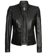 Black leather biker jacket with quilted shoulder panels, a front zipper, and sleek zippered pockets. The jacket has a stylish, edgy look.
