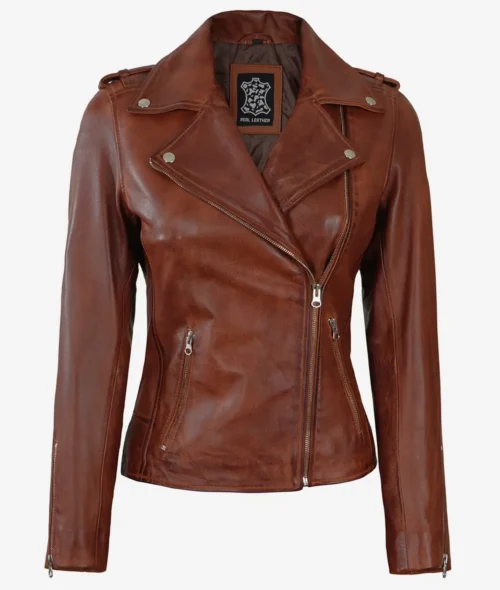 Brown leather jacket with a notched collar and silver zippers, featuring a stylish, fitted design. The label reads Real Leather.