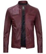 Burgundy leather jacket with a sleek design, featuring a zip-up front, high collar, and two horizontal chest pockets, exuding a stylish, modern vibe.