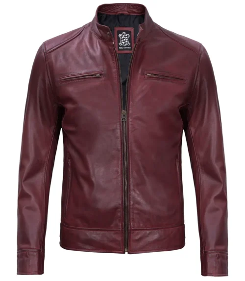 Burgundy leather jacket with a sleek zip-up front, two chest pockets, and a stand collar. The smooth finish gives a stylish, modern look.