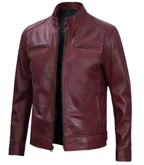 A sleek maroon leather jacket with a stand-up collar, zippered front, and pockets. The rich color and smooth texture convey a stylish, modern vibe.