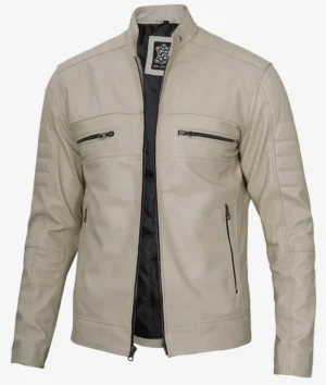 Beige leather jacket with a standing collar and quilted sleeves. Features four zip pockets and an open front, revealing a black inner lining. Stylish and modern.