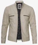 Beige leather jacket with a stand collar, front zipper open to show black lining. Features four zippered pockets, two on the chest and two at the waist.