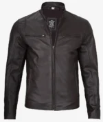 A sleek, dark brown leather jacket with a front zipper, two zipped chest pockets, and a standing collar. The jacket exudes a classic, stylish vibe.