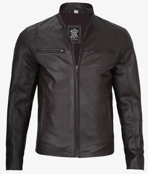 A sleek, dark brown leather jacket with a front zipper, two zipped chest pockets, and a standing collar. The jacket exudes a classic, stylish vibe.
