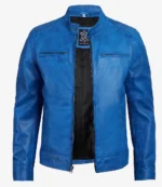 Vibrant blue leather jacket with sleek design, featuring a zippered front, stand-up collar, and two chest pockets. The interior is black.