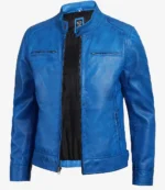 Blue leather jacket with a sleek design featured on a white background. It has a zipper closure, two chest pockets, and a black interior lining.
