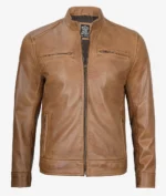 Brown leather jacket with a stand collar, front zipper, and two chest pockets. The jacket has a smooth, vintage look, conveying a classic style.