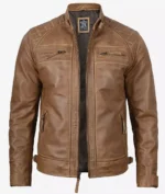 Brown leather jacket with a high collar, zipper closure, and multiple zippered pockets. The jacket has a rugged, vintage look.