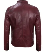 Maroon leather jacket, back view, with a sleek design and prominent stitching. The jacket features zippers on the sleeves and a smooth, glossy finish.