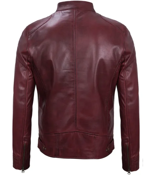 Maroon leather jacket, back view, with a sleek design and prominent stitching. The jacket features zippers on the sleeves and a smooth, glossy finish.