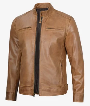A tan leather jacket with a stand collar, front zipper, and two chest pockets. The leather has a smooth finish, conveying a classic, stylish look.