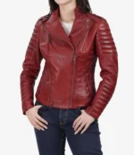 Red leather jacket with quilted sleeves, asymmetrical zip, and fitted silhouette. The image projects a stylish, edgy.