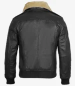 Back view of a black leather jacket with a fluffy beige collar. The jacket features detailed stitching and ribbed cuffs and hem, conveying a classic, rugged style.