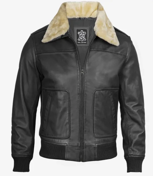 Black leather jacket with a cream faux fur collar, featuring a front zipper and patch pockets. The design exudes classic, rugged style.