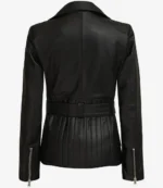 A sleek black leather jacket viewed from the back. It features a wide belt, quilted stitching on the lower back, and zippered cuffs, conveying a chic, modern style.