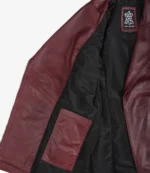 Open burgundy leather jacket displayed on a white background. Features a black lining and inside pocket, with a visible Real Leather label, evoking elegance.