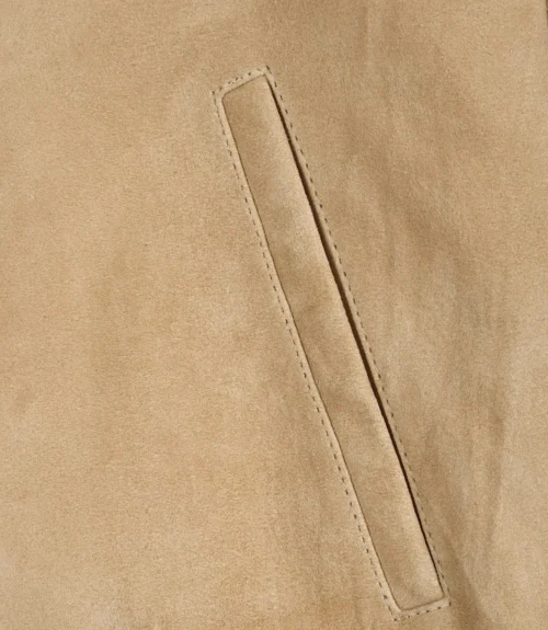 Close-up pocket detail on men’s camel suede leather jacket