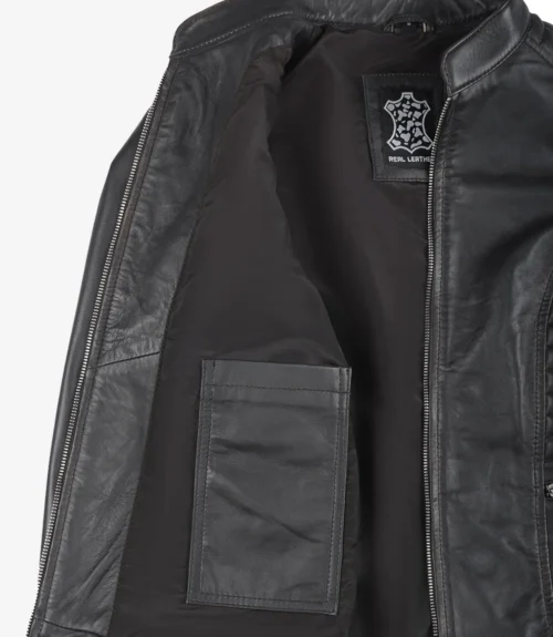 Open black leather jacket with interior view showing a label and a pocket. The zipper is partially visible, conveying a sense of style and durability.