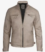 Beige leather jacket with a standing collar and front zipper, featuring quilted shoulders and zippered chest pockets. The design is sleek and modern.