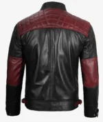 Black leather jacket with red quilted shoulder panels and red elbow patches. The jacket has a structured, stylish design with snap closures.
