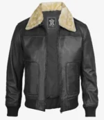 Black leather bomber jacket with a beige shearling collar, featuring a front zipper and two side pockets. The style is classic and rugged.