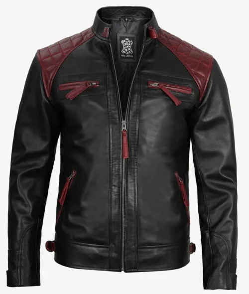 Black leather jacket with maroon quilted shoulder patches and zipper details. Has a sleek, edgy appearance with a front zipper closure.