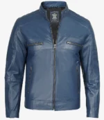 Blue leather jacket with a sleek design, featuring a stand collar, zipped pockets, and detailed stitching. It conveys a modern and stylish tone.