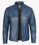 Blue leather jacket with a sleek design, featuring a stand-up collar, two chest zip pockets, quilted shoulder details, and a front zipper closure.