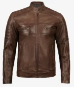 Brown leather jacket with a sleek design features a stand collar, front zipper, two chest zip pockets, and subtle shoulder detailing. Rugged yet stylish.