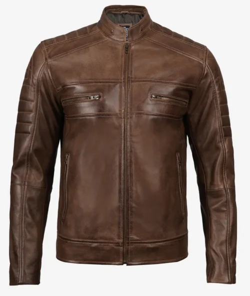 Brown leather jacket with a sleek design features a stand collar, front zipper, two chest zip pockets, and subtle shoulder detailing. Rugged yet stylish.