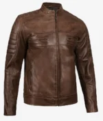 Brown leather jacket with a front zipper and two chest pockets. It features ribbed padded details on the shoulders and sleeves, exuding a rugged, stylish vibe.