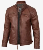 Brown leather jacket with a high collar and zippered front. Features include zippered chest and waist pockets, with a sleek and modern design.