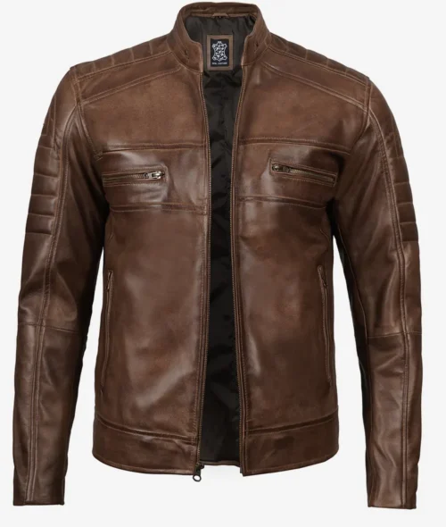 Brown leather jacket with a sleek design, featuring quilted shoulders, a front zip, and two zippered chest pockets, conveying a stylish, rugged look.