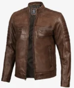 Brown leather jacket on a white background, featuring a front zipper, stand-up collar, and multiple pockets. The design is sleek and modern.