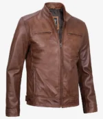 Brown leather jacket with a sleek, modern design. Features include a front zipper, two chest pockets, and a stand collar. Casual and stylish.