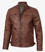 Brown leather jacket with a front zipper and stand collar. Features zipped chest and side pockets, quilted shoulder design; emits a rugged, stylish vibe.