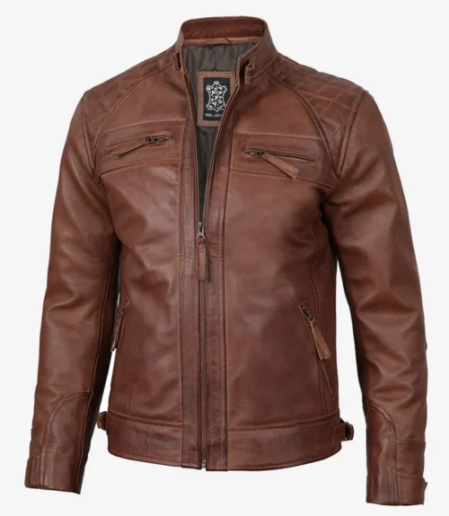 Brown leather jacket with a front zipper and stand collar. Features zipped chest and side pockets, quilted shoulder design; emits a rugged, stylish vibe.