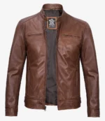 Brown leather jacket with a high collar and zip-up front, featuring two vertical chest pockets. The interior showcases a dark lining. Classic and sleek design.
