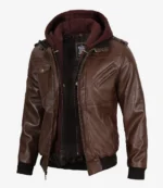 Brown leather jacket with multiple zippers and pockets, featuring a detachable maroon hoodie. Stylish and rugged, blending casual with edgy.